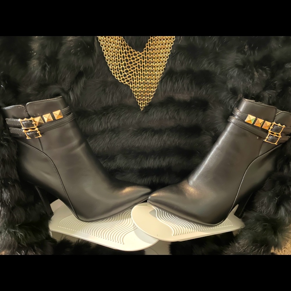 Sexy black bootie with gold accents.